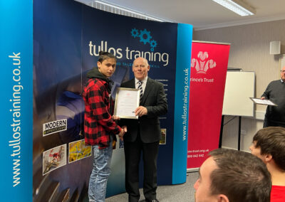 Jack Molina accepts his certificate from Iain Garrett, CEO at Tullos Training Ltd
