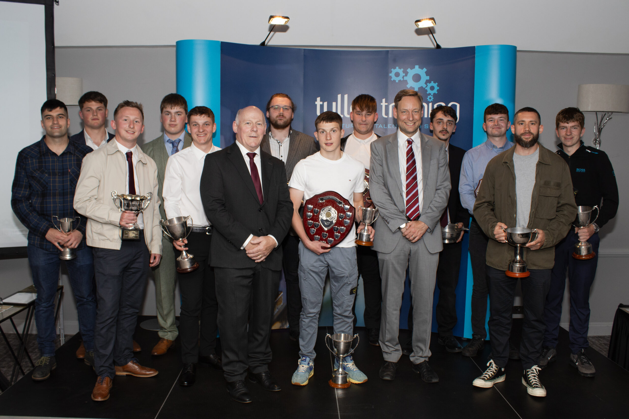 Tullos Training's 2023 Annual Award Winners pictured with CEO, Iain Garrett, and guest speaker, Liam Kerr MSP.