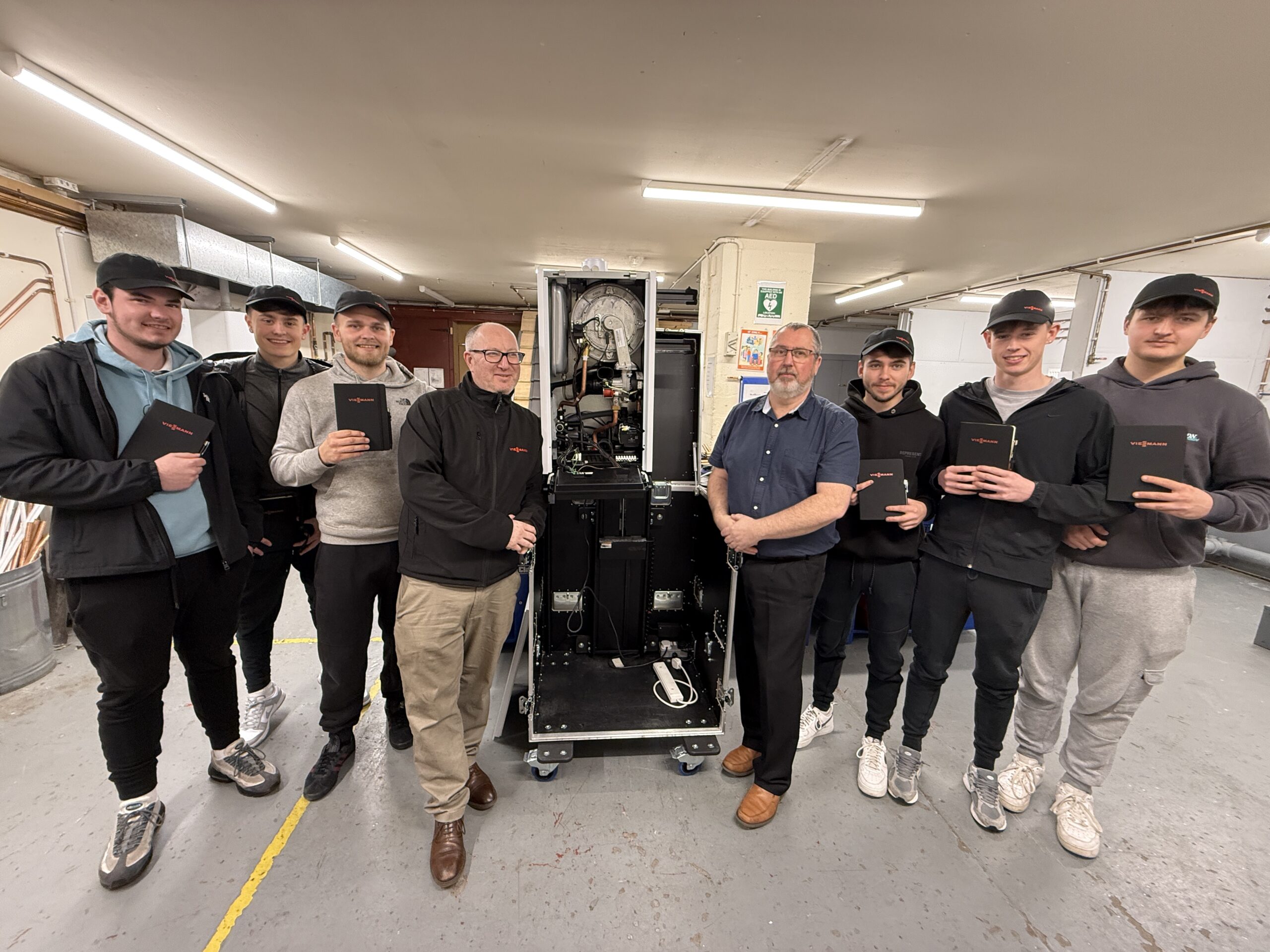 6 of our 3rd year plumbing apprentices are pictured with Steven McAllister of Viessmann Boilers and their Tullos Training instructor, Steve Arbuckle.  They are pictured with a Viessmann boiler in Tullos Training's dedicated plumbing workshop.